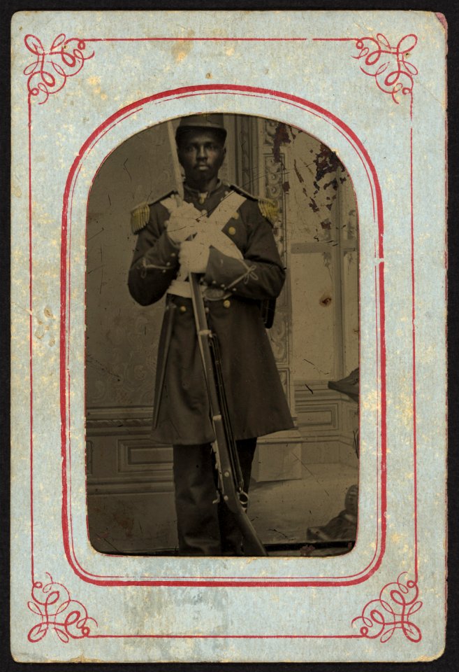 Post war soldier wearing white cross belt, oval US buckel, double breasted coat, epaulets, shako red, white and blue pompom, holding 45-70 rifle with fixed bayonet, wearing gloves, painted LCCN2010650829