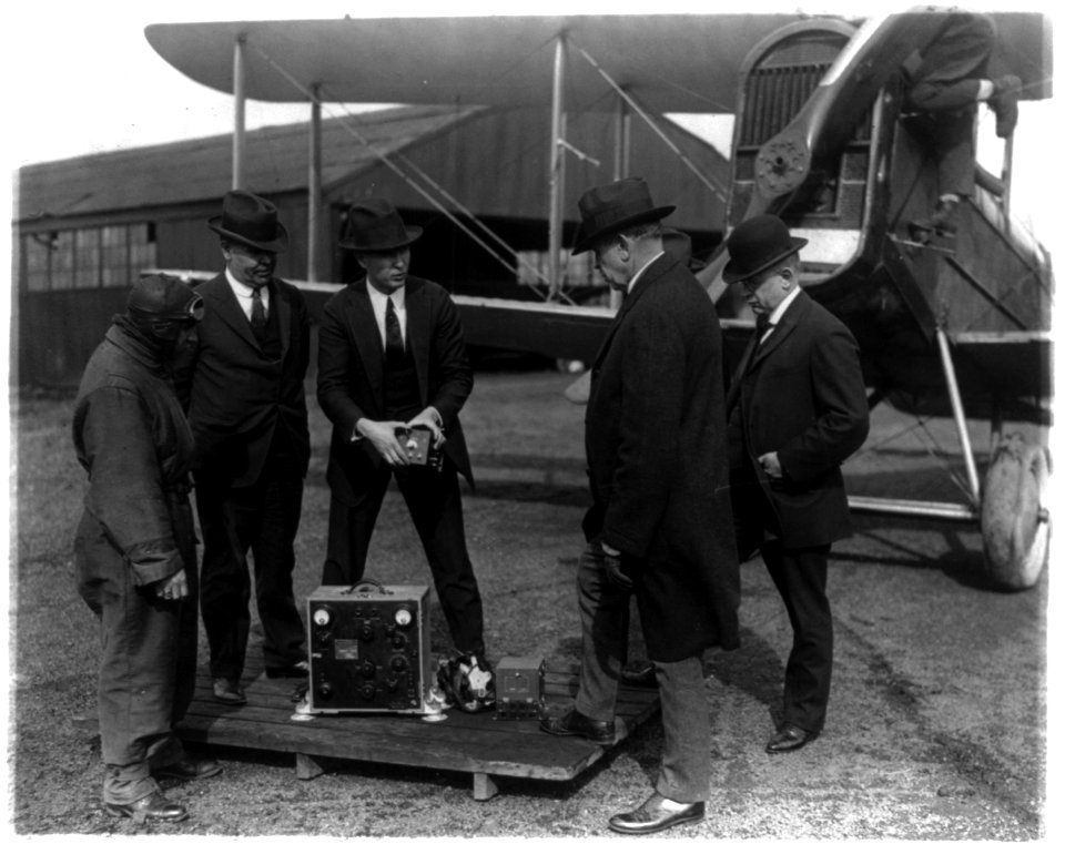 Postmaster General Work and his assistants inspecting the Radio equipment recently installed on aero mail planes LCCN2002695684