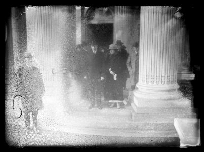 Pres. and Mrs. Coolidge leaving memorial hall after attending annual budget meeting which he addressed LCCN2016887067