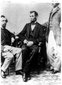 President Abraham Lincoln seated with his secretaries John Hay and John Nicolay LCCN2009630699