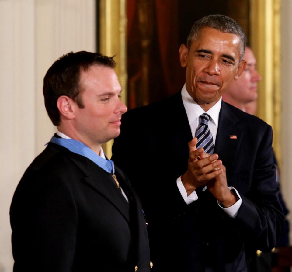President Barack Obama applauds Senior Chief Special Warfare Operator (SEAL) Edward C. Byers Jr. during a Medal of Honor presentation ceremony (24756817573)