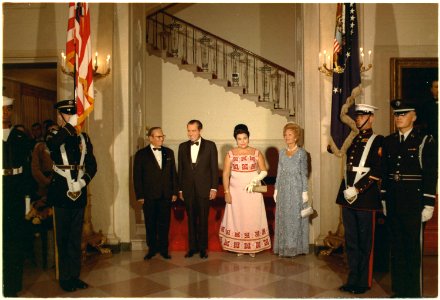 President and Mrs. Nixon and President Josip Broz Tito and Mrs. Tito, in black tie, enroute to a dinner in President... - NARA - 194387