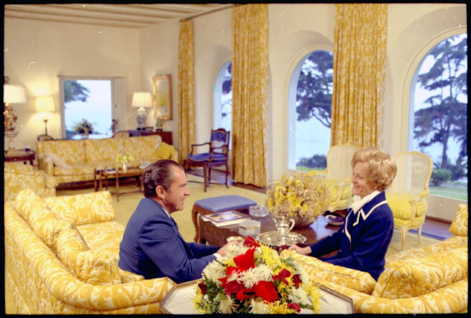 President and Mrs. Nixon sitting in the living room of their San Clemente home. - NARA - 194344