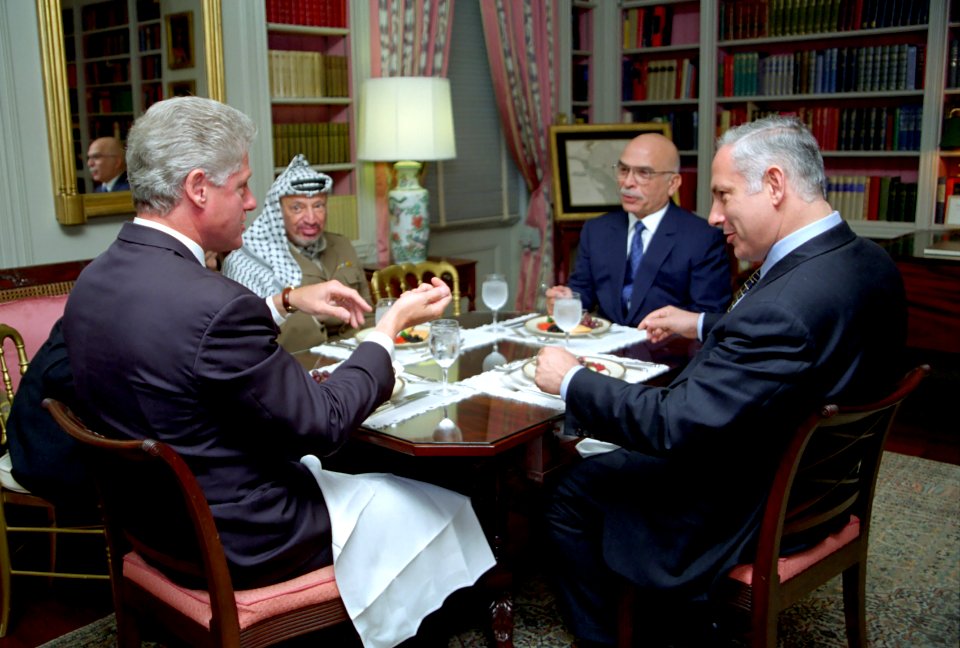 President Bill Clinton has lunch with King Hussein of Jordan, Prime Minister Benjamin Netanyahu of Israel, and Chairman Yasser Arafat of the Palestinian Authority