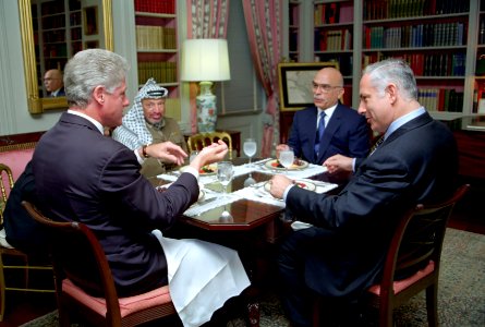 President Bill Clinton has lunch with King Hussein of Jordan, Prime Minister Benjamin Netanyahu of Israel, and Chairman Yasser Arafat of the Palestinian Authority