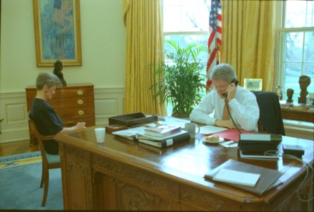 President Bill Clinton talking on the telephone in the Oval Office with President Francois Mitterand of France (02)