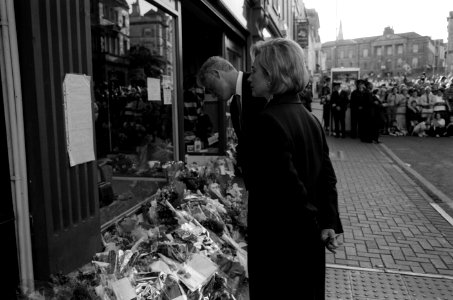 President Bill Clinton and First Lady Hillary Clinton view the flowers at the site of the Omagh bombing