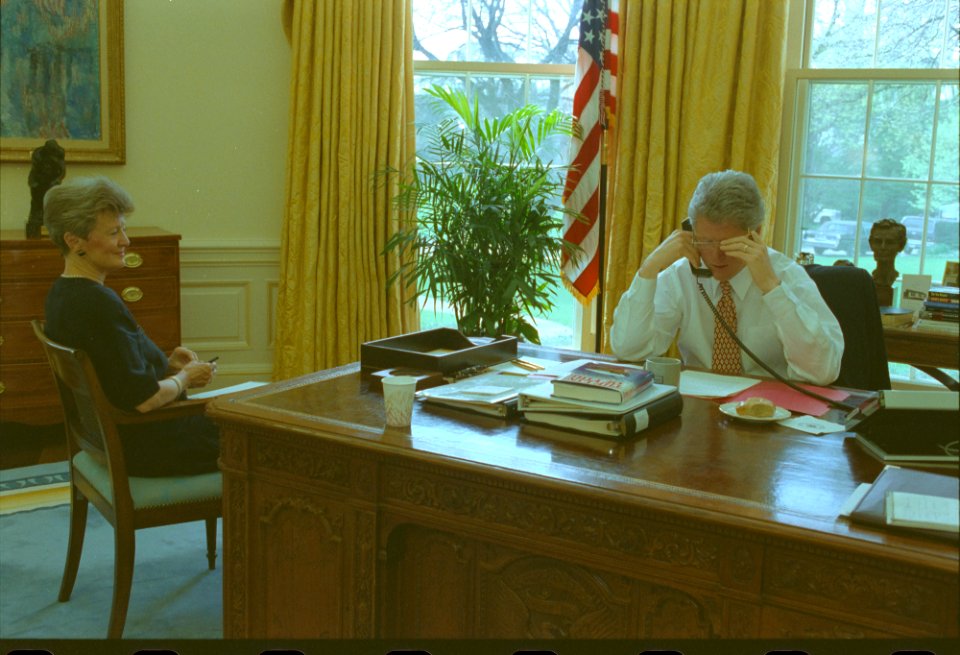 President Bill Clinton talking on the telephone in the Oval Office with President Francois Mitterand of France (06)