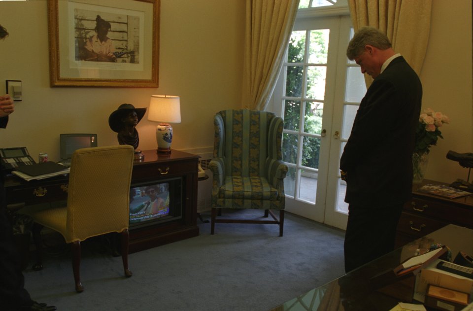 President Bill Clinton watching coverage of the Oklahoma City bombing