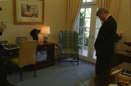 President Bill Clinton watching coverage of the Oklahoma City bombing
