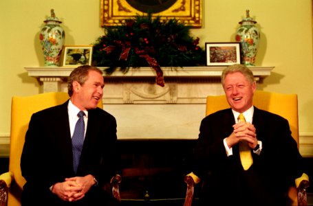 President Bill Clinton and President-Elect George W. Bush hold a meeting in the Oval Office photo