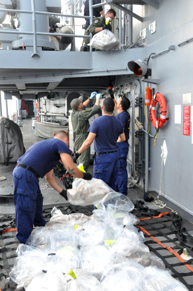 Preparing an estimated $78M of confiscated cocaine for transfer to US Coast Guard cutter USCGC Forward (WMEC 911) 130915-N-IC228-003