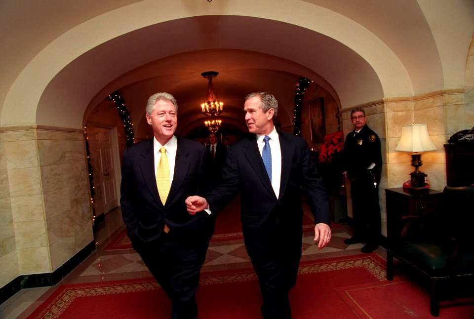President Bill Clinton and President-Elect George W. Bush walk through the White House