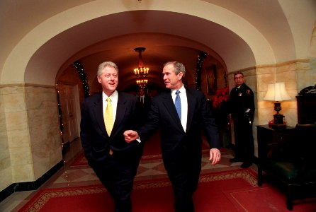 President Bill Clinton and President-Elect George W. Bush walk through the White House