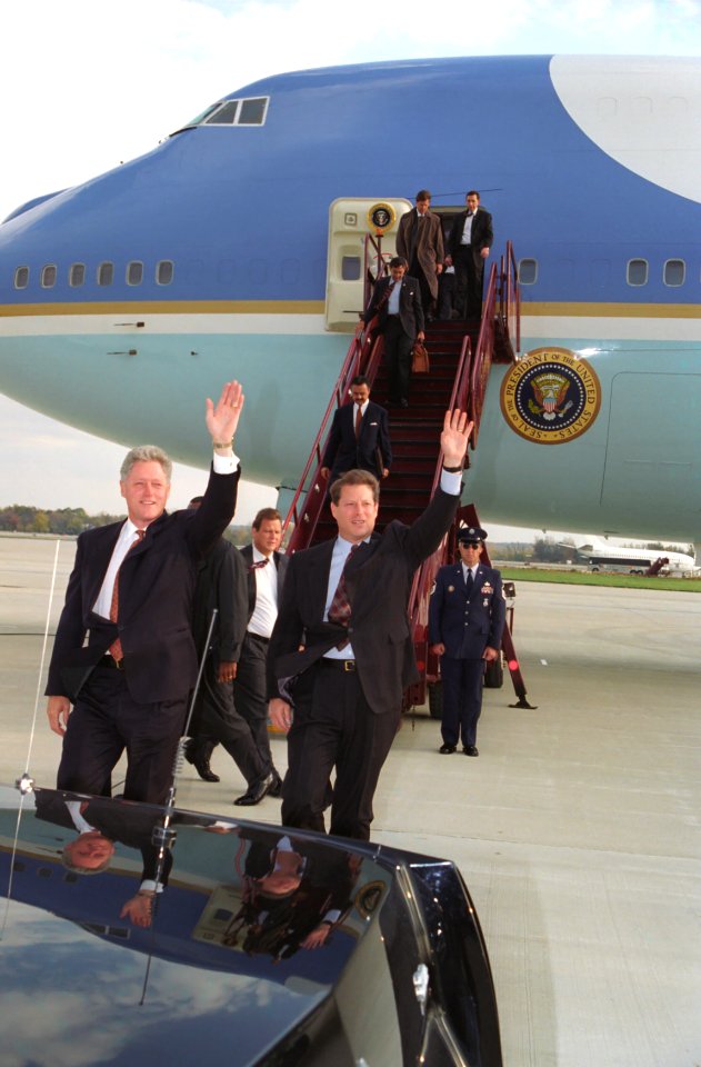 President Bill Clinton and Vice President Al Gore disembark from Air Force One