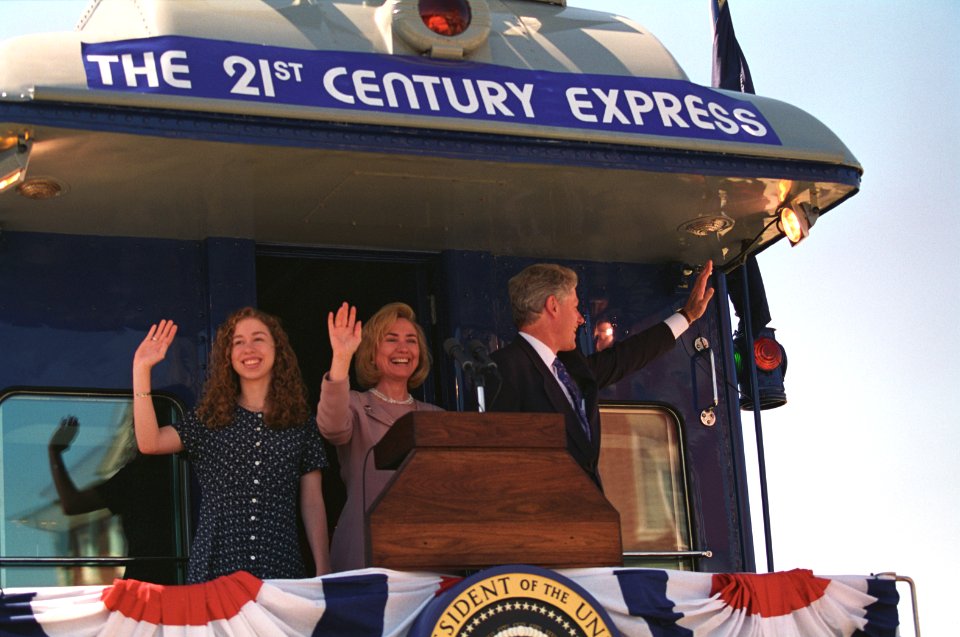 President Bill Clinton, Hillary Rodham Clinton, and Chelsea Clinton Waving from a Train
