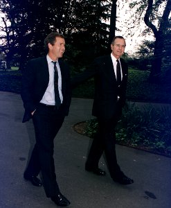 President Bush walks up the South Lawn towards the Oval Office with his son, George W. Bush - NARA - 186449 photo