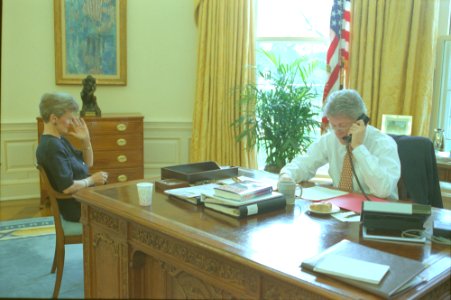President Bill Clinton talking on the telephone in the Oval Office with President Francois Mitterand of France (04)