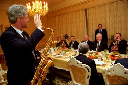 President Bill Clinton with a saxophone at a dinner hosted President Boris Yeltsin photo