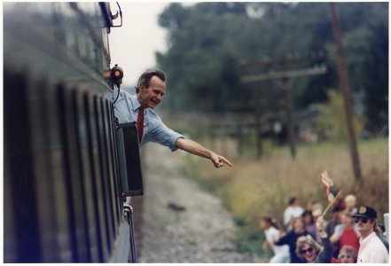 President Bush waves from the back of the train outside of Bowling Green as he travels on a whistlestop campaign... - NARA - 186459
