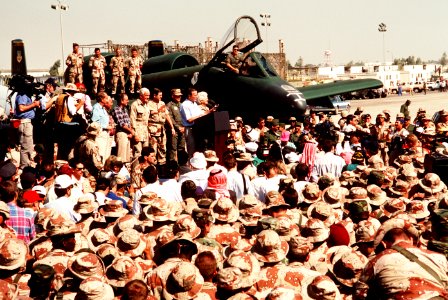 President George H. W. Bush speaks to a crowd at an air base in Saudi Arabia