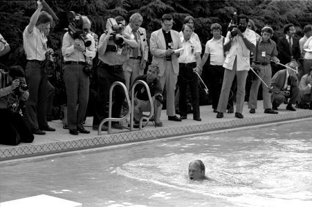 President Gerald Ford takes his first swim in the new White House pool
