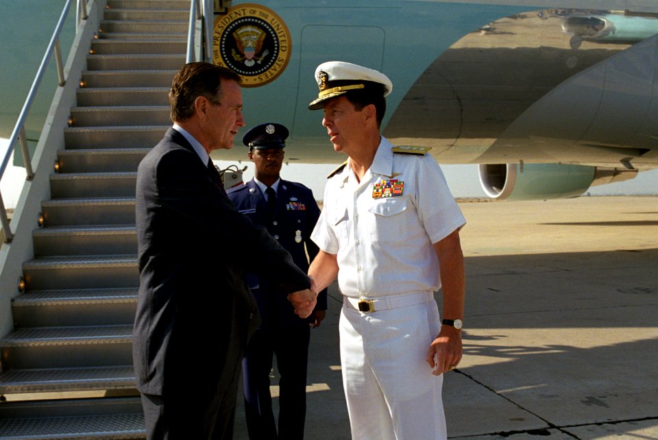 President George H. W. Bush is greeted at NAS Miramar by US Navy Rear Admiral Paul W. Parcells