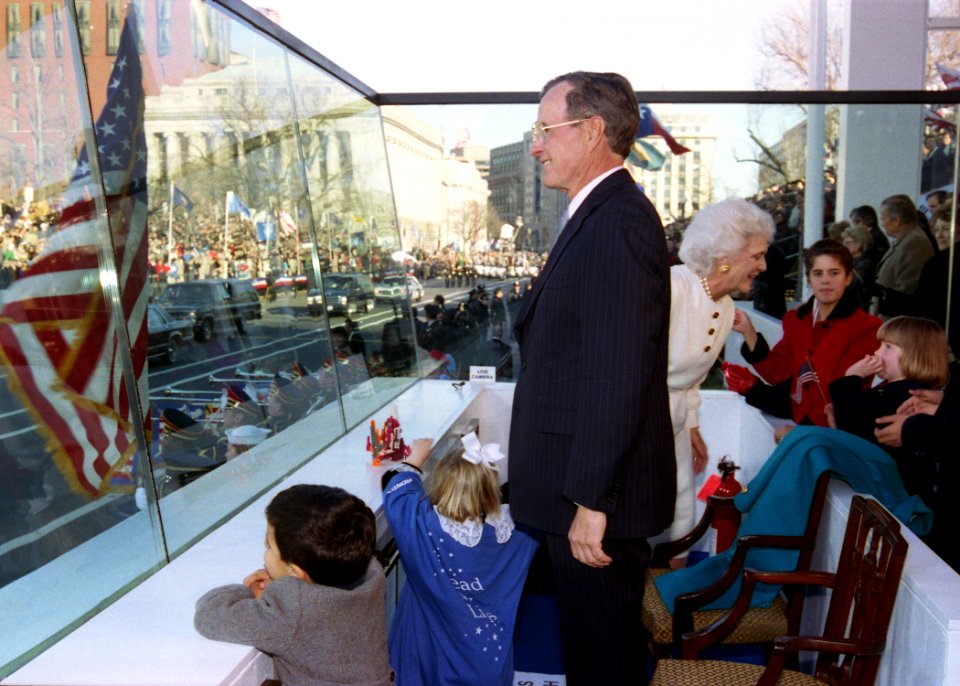 President George H. W. Bush Watches the Inaugural Parade from the Reviewing Stand with Various Members of His Family