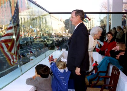 President George H. W. Bush Watches the Inaugural Parade from the Reviewing Stand with Various Members of His Family