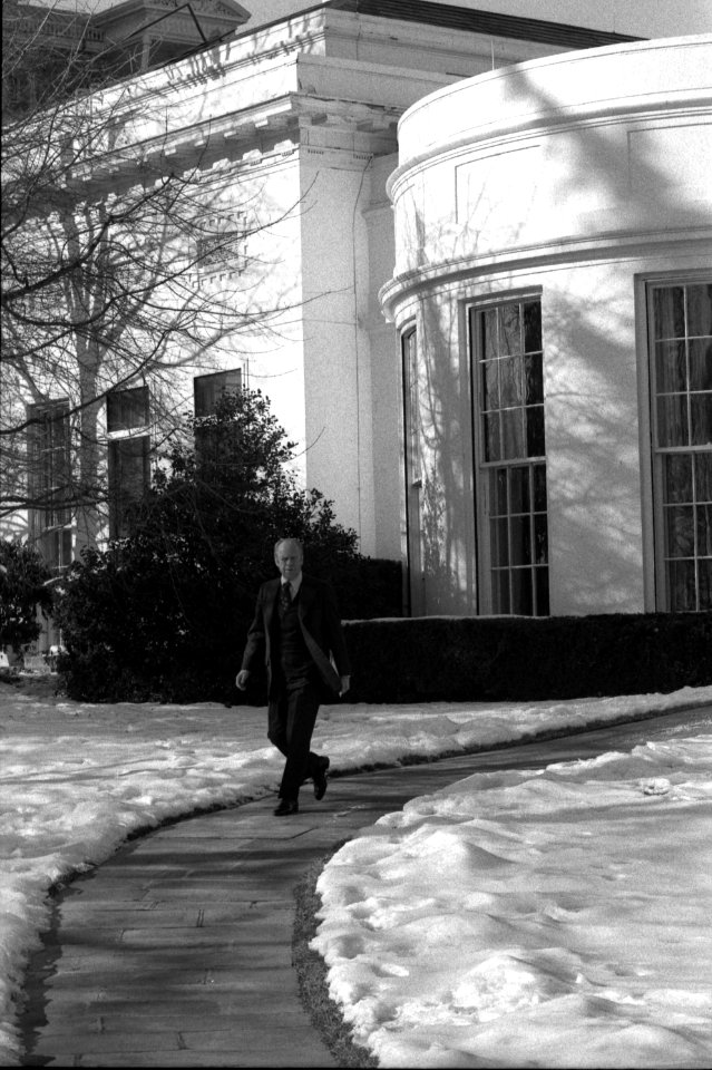 President Gerald Ford departs the Oval Office for an event at the National War College