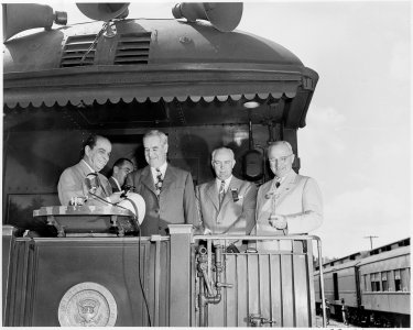 President Harry S. Truman, President Romulo Gallegos of Venezuela, and thre unidentified men, standing on the rear... - NARA - 199893