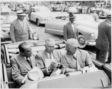 President Harry S. Truman, President Romulo Gallegos of Venezuela, and an unidentified man sitting in a convertible... - NARA - 199910