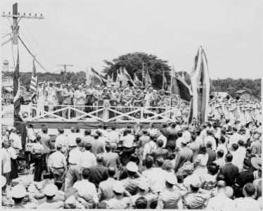 President Harry S. Truman, President Romulo Gallegos of Venezuela, and other dignitaries on the reviewing platform... - NARA - 199920