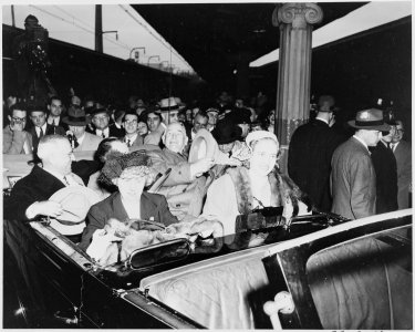 President Harry S. Truman, Vice President-elect Alben W. Barkley, Bess Truman, and Margaret sitting in an open car in... - NARA - 199944 photo