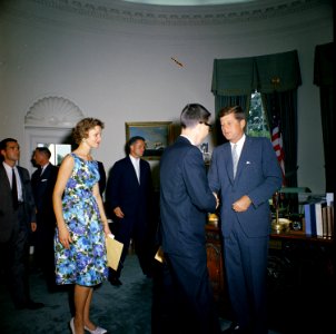 President John F. Kennedy greets the first group of Peace Corps Volunteers going to Tanganyika and Ghana, in the the Oval Office - KN-C18660 photo