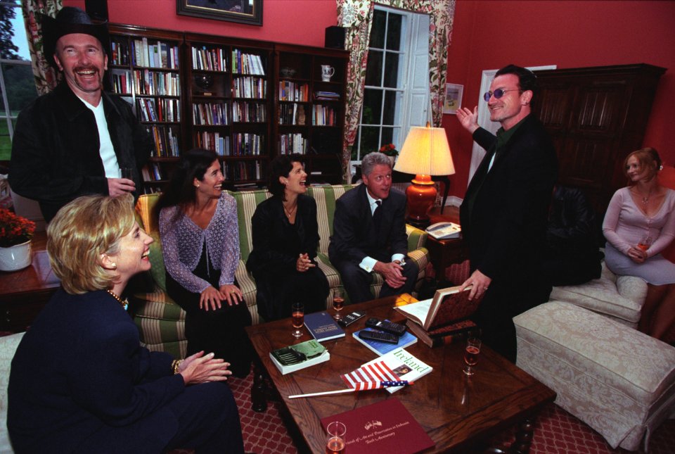 President Bill Clinton and First Lady Hillary Clinton visit with the band U2