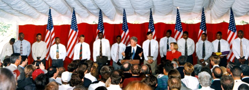 President Bill Clinton and Hillary Clinton with the University of Arkansas NCAA championship basketball team photo