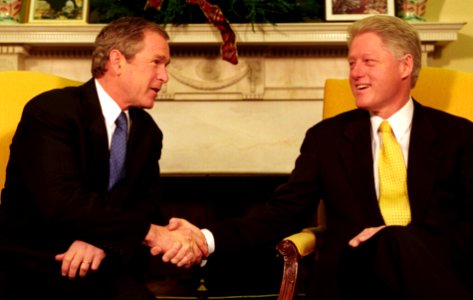President Bill Clinton and President-Elect George W. Bush shake hands during their meeting in the Oval Office (1)