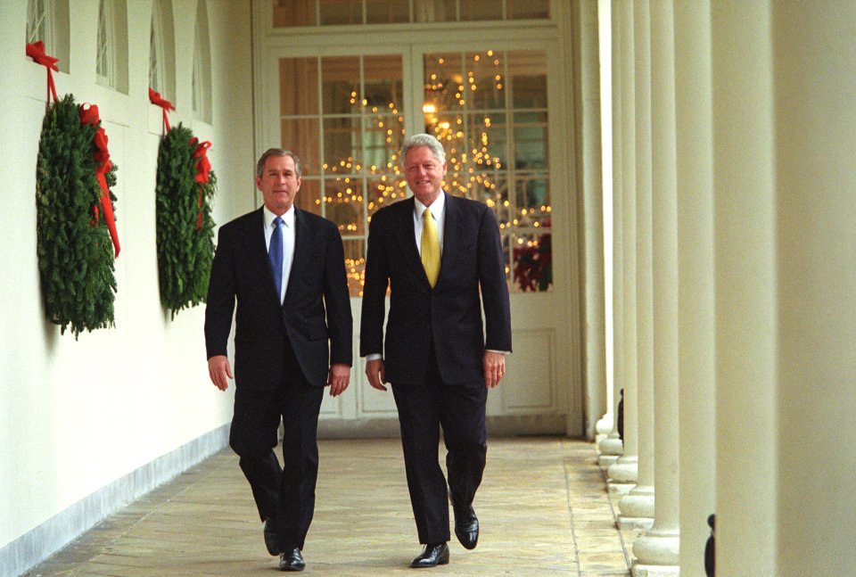 President Bill Clinton and President-Elect George W. Bush walk along the White House colonnade to the Oval Office