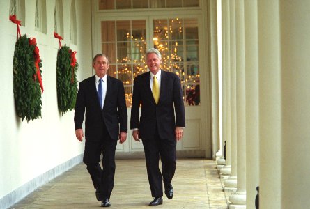 President Bill Clinton and President-Elect George W. Bush walk along the White House colonnade to the Oval Office