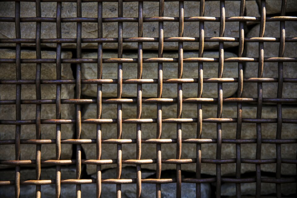Metal fence rocks