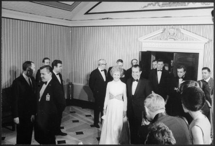 President and Mrs. Nixon arriving at an Inaugural ball - NARA - 194600 photo