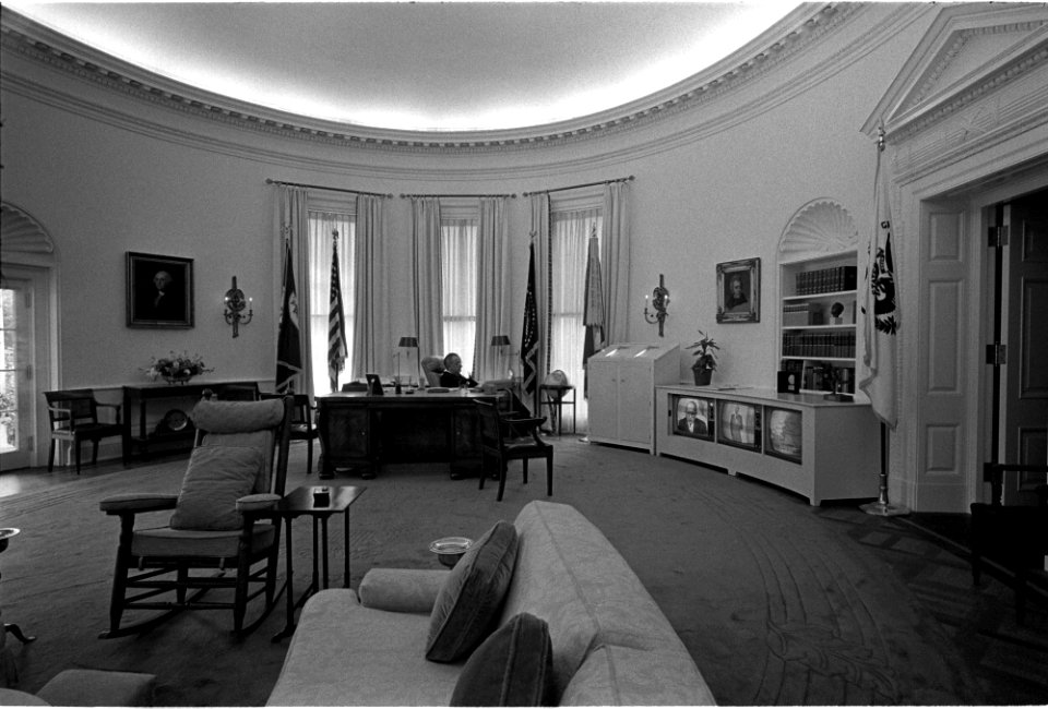 President Johnson watches TV in the Oval Office