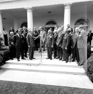 President John F. Kennedy with Representatives from United Negro Colleges Development Campaign JFKWHP-ST-415-1-63