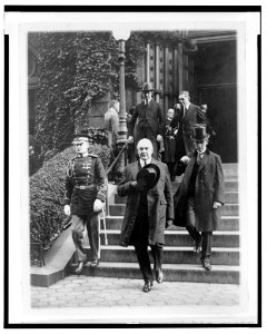 President Harding and his secty. George Christian leaving St. Patricks Church after attending the funeral of Senor Don J. Antonio Lopez Gutierrez, Minister of Honduras, today LCCN2003675573