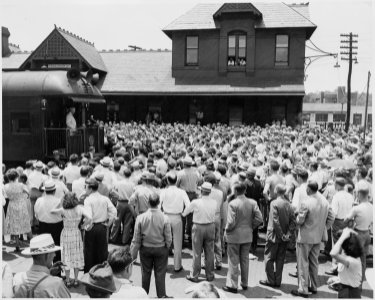 President Harry S. Truman on the rear platform of the presidential train, speaking to a crowd, in Parkersburg, West... - NARA - 199930