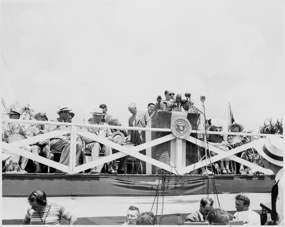 President Harry S. Truman, President Romulo Gallegos of Venezuela and other dignitaries on the reviewing platform in... - NARA - 199913