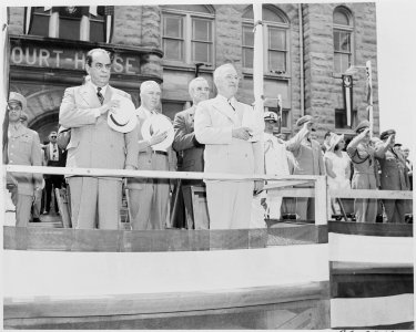 President Harry S. Truman, President Romulo Gallegos of Venezuela, and other dignitaries, standing on the reviewing... - NARA - 199904