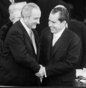 President Lyndon Baines Johnson shakes hands with President-elect Richard M. Nixon - NARA - 194602 (1)