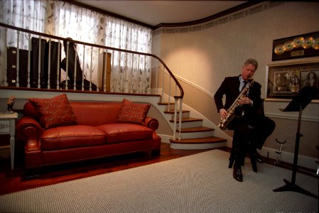 President Bill Clinton plays the saxophone in the Music Room photo